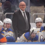 Jan 24, 2026; Elmont, New York, USA; Buffalo Sabres head coach Lindy Ruff coaches against the New York Islanders during the first period at UBS Arena. Mandatory Credit: Brad Penner-Imagn Images