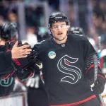 Apr 9, 2026; Seattle, Washington, USA;  Seattle Kraken forward Bobby McMann (74) is congratulated by teammates on the bench after scoring a goal during the third period against the Vegas Golden Knights at Climate Pledge Arena. Mandatory Credit: Stephen Brashear-Imagn Images