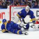 May 6, 2026; Buffalo, New York, USA; Buffalo Sabres goaltender Alex Lyon (34) looks for the puck after defenseman Rasmus Dahlin (26) blocks a shot during the third period against the Montréal Canadiens in game one of the second round of the 2026 Stanley Cup Playoffs at KeyBank Center. Mandatory Credit: Timothy T. Ludwig-Imagn Images