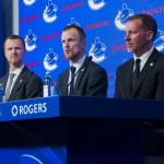 Frank Seravalli reveals internal conflict behind controversial Vancouver Canucks front office hire May 14, 2026; Vancouver, BC, Canada; The Vancouver Canucks promoted Henrik Sedin (left), his twin brother Daniel Sedin (center) to co-presidents and Ryan Johnson (right) was named the Canucks new general manger during a press conference at Rogers Arena. Mandatory Credit: Bob Frid-Imagn Images