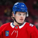 Mar 17, 2026; Montreal, Quebec, CAN; Montreal Canadiens right wing Cole Caufield (13) looks on during warm-up before the game against the Boston Bruins at Bell Centre.