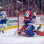 May 10, 2026; Montreal, Quebec, CAN; Buffalo Sabres forward Beck Malenstyn (29) collides with Montreal Canadiens goalie Jakub Dobes (75) during the second period in game three of the second round of the 2026 Stanley Cup Playoffs at the Bell Centre. Mandatory Credit: Eric Bolte-Imagn Images