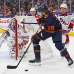 Feb 17, 2023; Edmonton, Alberta, CAN; Edmonton Oilers forward Leon Draisaitl (29) looks to make a pass from behind New York Rangers goaltender Igor Shesterkin (31) during the third period at Rogers Place.