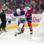Dec 14, 2025; Montreal, Quebec, CAN; Edmonton Oilers forward Connor McDavid (97) plays the puck as Montreal Canadiens forward Oliver Kapanen (91) defends during the first period at the Bell Centre. Mandatory Credit: Eric Bolte-Imagn Images