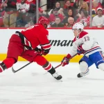 Mar 29, 2026; Raleigh, North Carolina, USA; Montreal Canadiens right wing Cole Caufield (13) stops in front of Carolina Hurricanes defenseman K\'andre Miller (19) during the second period at Lenovo Center.