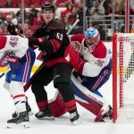 Jakub Dobes ignores referee's warning and shows Canadiens exactly what they needed May 21, 2026; Raleigh, North Carolina, USA; Carolina Hurricanes right wing Jackson Blake (53) battles Montreal Canadiens defenseman Alexandre Carrier (45) and goaltender Jakub Dobes (75) for position in front of the net during the third period in game one of the Eastern Conferene Final of the 2026 Stanley Cup Playoffs at Lenovo Center. Mandatory Credit: James Guillory-Imagn Images