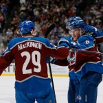 Nov 20, 2025; Denver, Colorado, USA; Colorado Avalanche defenseman Cale Makar (8) celebrates his goal with center Martin Necas (88) and center Nathan MacKinnon (29) in the second period against the New York Rangers at Ball Arena. Mandatory Credit: Isaiah J. Downing-Imagn Images