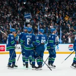 Apr 14, 2026; Vancouver, British Columbia, CAN; The Vancouver Canucks celebrate their victory against the Los Angeles Kings at Rogers Arena.