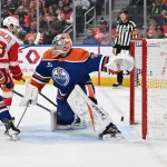 Dec 11, 2025; Edmonton, Alberta, CAN; Edmonton Oilers goalie Stuart Skinner (74) and Detroit Red Wings right winger Alex DeBrincat (93) are seen out on the ice during the second period at Rogers Place.