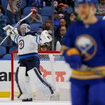 Jan 12, 2023; Buffalo, New York, USA; Winnipeg Jets goaltender Connor Hellebuyck (37) reacts after beating the Buffalo Sabres at KeyBank Center. Mandatory Credit: Timothy T. Ludwig-Imagn Images