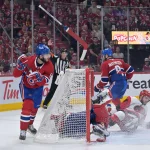May 25, 2026; Montreal, Quebec, CAN; Carolina Hurricanes defenseman Sean Walker (26) collides with Montreal Canadiens goaltender Jakub Dobes (75) and defenseman Noah Dobson (53) during the second period in game three of the Eastern Conference Final of the 2026 Stanley Cup Playoffs at Bell Centre. Mandatory Credit: Eric Bolte-Imagn Images