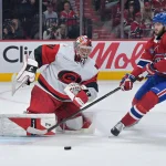 May 25, 2026; Montreal, Quebec, CAN; Carolina Hurricanes goaltender Frederik Andersen (31) watches the puck against Montreal Canadiens defenseman Noah Dobson (53) during the first period in game three of the Eastern Conference Final of the 2026 Stanley Cup Playoffs at Bell Centre.