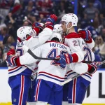 Apr 19, 2026; Tampa, Florida, USA; Montreal Canadiens forward Juraj Slafkovsky (20) reacts to scoring a goal with defenseman Lane Hutson (48), forward Nick Suzuki (14), and forward Cole Caufield (13) against the Tampa Bay Lightning during the second period in game one of the first round of the 2026 Stanley Cup Playoffs at Benchmark International Arena. Mandatory Credit: Morgan Tencza-Imagn Images