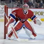 Apr 15, 2022; Montreal, Quebec, CAN; Montreal Canadiens goalie Carey Price (31) tracks the puck in the corner during the first period of the game against the New York Islanders at the Bell Centre. Mandatory Credit: Eric Bolte-Imagn Images