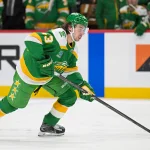 Apr 2, 2026; Saint Paul, Minnesota, USA; Minnesota Wild defensemen Quinn Hughes (43) controls the puck against the Vancouver Canucks during the second period at Grand Casino Arena. Mandatory Credit: Nick Wosika-Imagn Images
