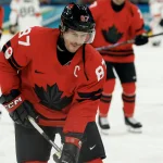 Feb 13, 2026; Milan, Italy; Sidney Crosby of Canada during the warm up before the match against Switzerland in men\'s ice hockey group A play during the Milano Cortina 2026 Olympic Winter Games at Milano Santagiulia Ice Hockey Arena. Mandatory Credit: Geoff Burke-Imagn Images