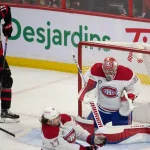 Apr 23, 2022; Ottawa, Ontario, CAN; Montreal Canadiens goalie Carey Prices (31) makes a save as Ottawa Senators right wing Drake Batherson (19) looks on in the third period at the Canadian Tire Centre. Mandatory Credit: Marc DesRosiers-Imagn Images