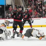 Jun 4, 2026; Raleigh, North Carolina, USA; Vegas Golden Knights defenseman Brayden McNabb (3) reacts to a puck to the face during the first period against the Carolina Hurricanes in game two of the 2026 Stanley Cup Final at Lenovo Center.