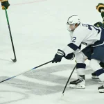Oct 10, 2025; University Park, PA, USA; Penn State Nittany Lions forward Gavin McKenna (72) skates past Clarkson Golden Knights defenseman Noah Houle (3) during the third period at Pegula Ice Arena.