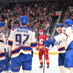 Dec 23, 2025; Edmonton, Alberta, CAN; Edmonton Oilers defenseman Evan Bouchard (2) along with Oilers center Connor McDavid (97) with Edmonton Oilers center Leon Draisaitl (29) and Oilers left winger Zach Hyman (18) celebrate a goal on Calgary Flames goalie Dustin Wolf (32) during the first period at Rogers Place.