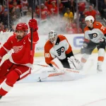 Mar 28, 2026; Detroit, Michigan, USA; Detroit Red Wings center Dylan Larkin (71) celebrates after scoring on Philadelphia Flyers goaltender Dan Vladar (80) in the second period at Little Caesars Arena.