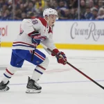 Sep 27, 2025; Toronto, Ontario, CAN; defenseman Lane Hutson (48) carries the puck against the Toronto Maple Leafs during the second period at Scotiabank Arena.
