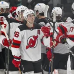 Mar 24, 2026; Dallas, Texas, USA; New Jersey Devils center Jack Hughes (86) celebrates the win over the Dallas Stars with his teammates at the American Airlines Center.