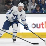 Apr 2, 2026; San Jose, California, USA; Toronto Maple Leafs defenseman Morgan Rielly (44) looks to pass the puck during the first period against the San Jose Sharks at SAP Center at San Jose.