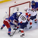 May 30, 2024; New York, New York, USA; New York Rangers goaltender Igor Shesterkin (31) and defensemen Ryan Lindgren (55) and Adam Fox (23) fight for the puck against Florida Panthers left wing Matthew Tkachuk (19) and center Sam Bennett (9) during the second period of game five of the Eastern Conference Final of the 2024 Stanley Cup Playoffs at Madison Square Garden.