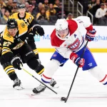 10 octobre 2024 ; Boston, Massachusetts, États-Unis ; le défenseur des Bruins de Boston, Hampus Lindholm (27), défend l'ailier droit des Canadiens de Montréal, Brendan Gallagher (11), durant la deuxième période au TD Garden.