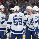 Jan 24, 2026; Columbus, Ohio, USA; Tampa Bay Lightning defenseman Darren Raddysh (facing) celebrates his goal with teammates during the first period against the Columbus Blue Jackets at Nationwide Arena.