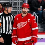 Nov 20, 2025; Detroit, Michigan, USA; Detroit Red Wings center Dylan Larkin (71) reacts in the second period against the New York Islanders at Little Caesars Arena.