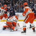 Dec 16, 2025; Columbus, Ohio, USA; Anaheim Ducks goalie Ville Husso (33) makes a save as Columbus Blue Jackets defenseman Zach Werenski (8) looks for a rebound during the second period at Nationwide Arena. :
