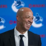 Jun 4, 2026; Vancouver, BC, CANADA; Manny Malhotra smiles during press conference where the Vancouver Canucks introduce Malhotra as their new head coach during a press conference at Rogers Arena.