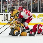 Jun 14, 2026; Las Vegas, Nevada, USA; Carolina Hurricanes center Sebastian Aho (20) reaches for the puck against Vegas Golden Knights right wing Mitch Marner (93) an dright wing Mark Stone (61) during the third period in game six of the 2026 Stanley Cup Final at T-Mobile Arena