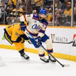 Jan 13, 2026; Nashville, Tennessee, USA; Edmonton Oilers defenseman Darnell Nurse (25) skates behind the net against the Nashville Predators during the third period at Bridgestone Arena.