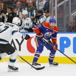 Mar 18, 2025; Edmonton, Alberta, CAN; Edmonton Oilers forward Leon Draisaitl (29) looks to make a pass in front of Utah Hockey Club defensemen Michael Kesselring (7) during the third period at Rogers Place.