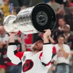 Jun 14, 2026; Las Vegas, Nevada, USA; Carolina Hurricanes right wing Andrei Svechnikov (37) raises the the Stanley Cup after defeating the Vegas Golden Knights in game six of the 2026 Stanley Cup Final at T-Mobile Arena.