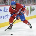 Jan 25, 2025; Montreal, Quebec, CAN; Montreal Canadiens forward Brendan Gallagher (11) plays the puck during the second period of the game against the New Jersey Devils at the Bell Centre.