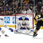 Oct 16, 2024; Pittsburgh, Pennsylvania, USA; Buffalo Sabres goaltender Ukko-Pekka Luukkonen (1) makes a save against Pittsburgh Penguins center Sidney Crosby (87) as defenseman Bowen Byram (4) defends during the third period at PPG Paints Arena.