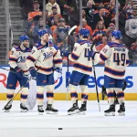 Dec 23, 2025; Edmonton, Alberta, CAN; Edmonton Oilers center Adam Henrique (19), center Connor McDavid (97), left winger Matt Jones (46), and goalie Connor Ingram (39) celebrate their win over the Calgary Flames during the third period at Rogers Place.
