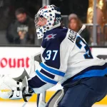 Apr 13, 2026; Las Vegas, Nevada, USA; Winnipeg Jets goaltender Connor Hellebuyck (37) warms up before the start of a game against the Vegas Golden Knights at T-Mobile Arena.