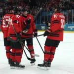 Feb 15, 2026; Milan, Italy; Cale Makar of Canada, Sidney Crosby of Canada, Connor McDavid of Canada and Sam Reinhart of Canada react against France in men's ice hockey group A play during the Milano Cortina 2026 Olympic Winter Games at Milano Santagiulia Ice Hockey Arena.