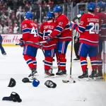Dec 17, 2024; Montreal, Quebec, CAN; Montreal Canadiens right wing Patrik Laine (92) celebrates his hat trick with his teammates as the ice gets covered with hats against the Buffalo Sabres during the second period at Bell Centre.