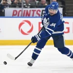 Mar 7, 2026; Toronto, Ontario, CAN; Toronto Maple Leafs forward Auston Matthews (34) shoots the puck against the Tampa Bay Lightning in the third period at Scotiabank Arena.
