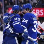 Apr 20, 2025; Toronto, Ontario, CAN; Toronto Maple Leafs forward Auston Matthews (34) congratulates forward Matthew Knies (23) on his goal against the Ottawa Senators during the third period of game one of the first round of the 2025 Stanley Cup Playoffs at Scotiabank Arena.