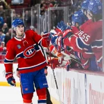 Dec 12, 2022; Montreal, Quebec, CAN; Montreal Canadiens center Kirby Dach (77) celebrates the winning goal in shootout against the Calgary Flames at Bell Centre.