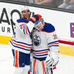 Apr 1, 2025; Las Vegas, Nevada, USA; Edmonton Oilers defenseman Darnell Nurse (25) celebrates with Edmonton Oilers goaltender Calvin Pickard (30) after the Oilers defeat the Vegas Golden Knights at T-Mobile Arena.