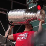 Jun 20, 2026; Raleigh, North Carolina, USA; Carolina Hurricanes center Jordan Staal (11) holds up the Stanley Cup trophy during the Stanley Cup championship parade and rally at Raleigh.