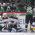 Apr 28, 2026; Dallas, Texas, USA; Dallas Stars left wing Jason Robertson (21) celebrates after he scores a goal past Minnesota Wild defenseman Jared Spurgeon (46) and goaltender Jesper Wallstedt (30) during the third period in game five of the first round of the 2026 Stanley Cup Playoffs at American Airlines Center.